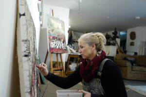 photo of the artist painting in her studio by Rick Davey