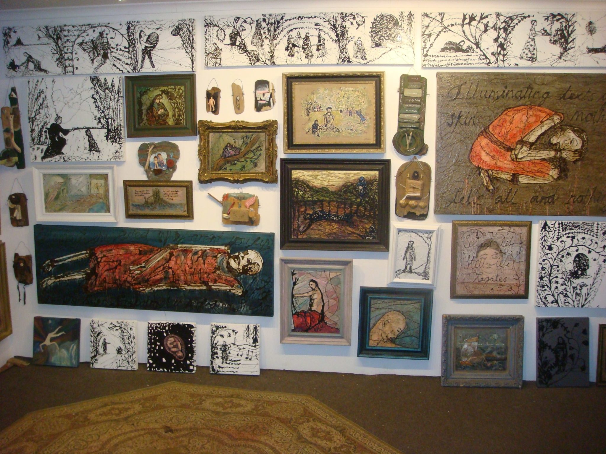 photo of gallery hang of paintings