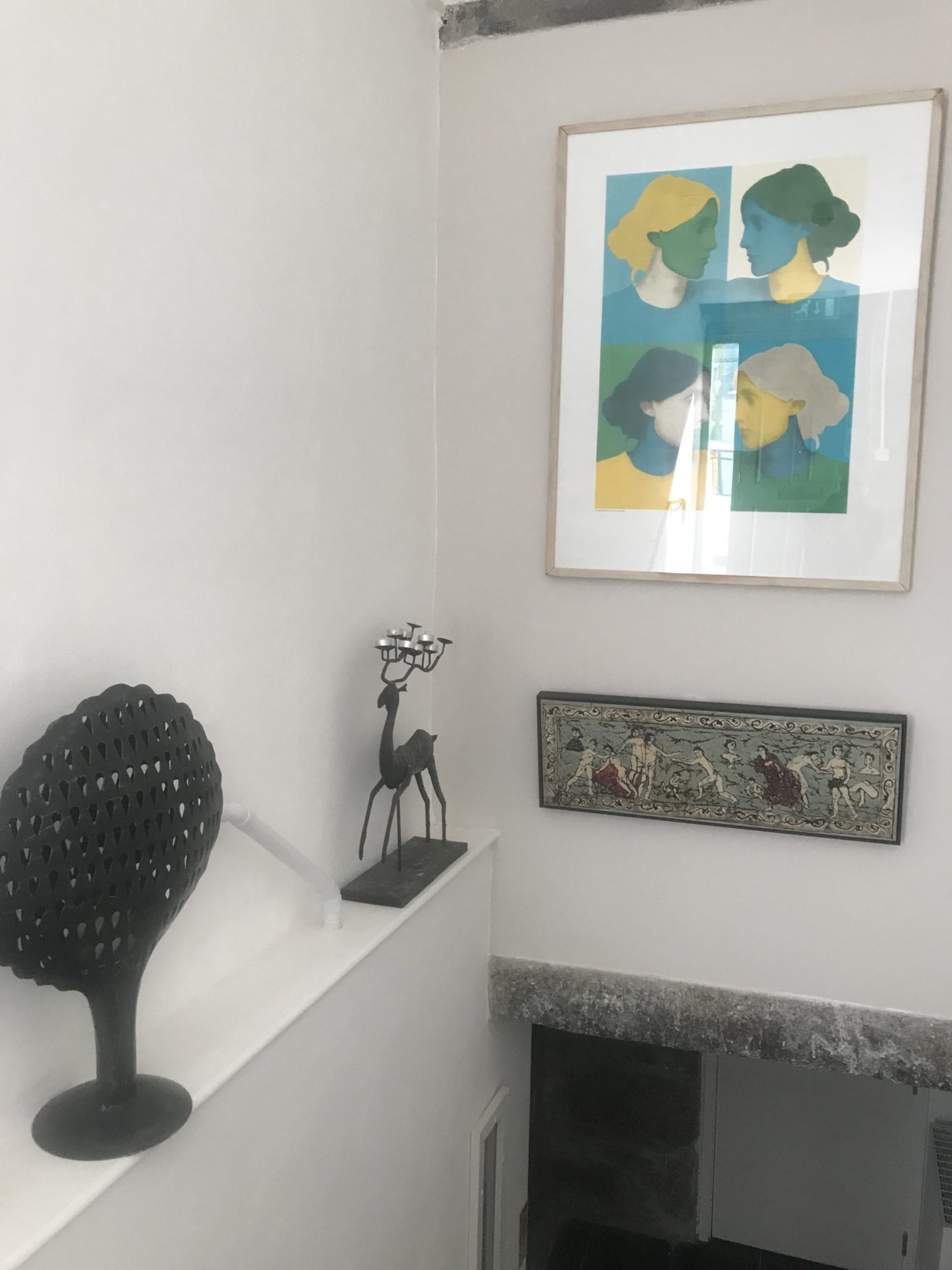 photo of my painting 'at the intersection of powers' hanging underneath another art work viginia woolf print in a private home
