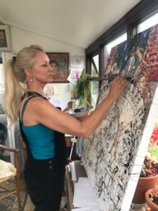 the artist painting at home