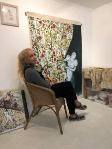show the artist with her work