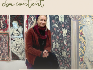 artist with her paintings