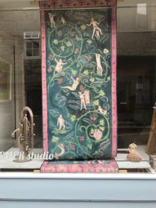 painting in an artists window
