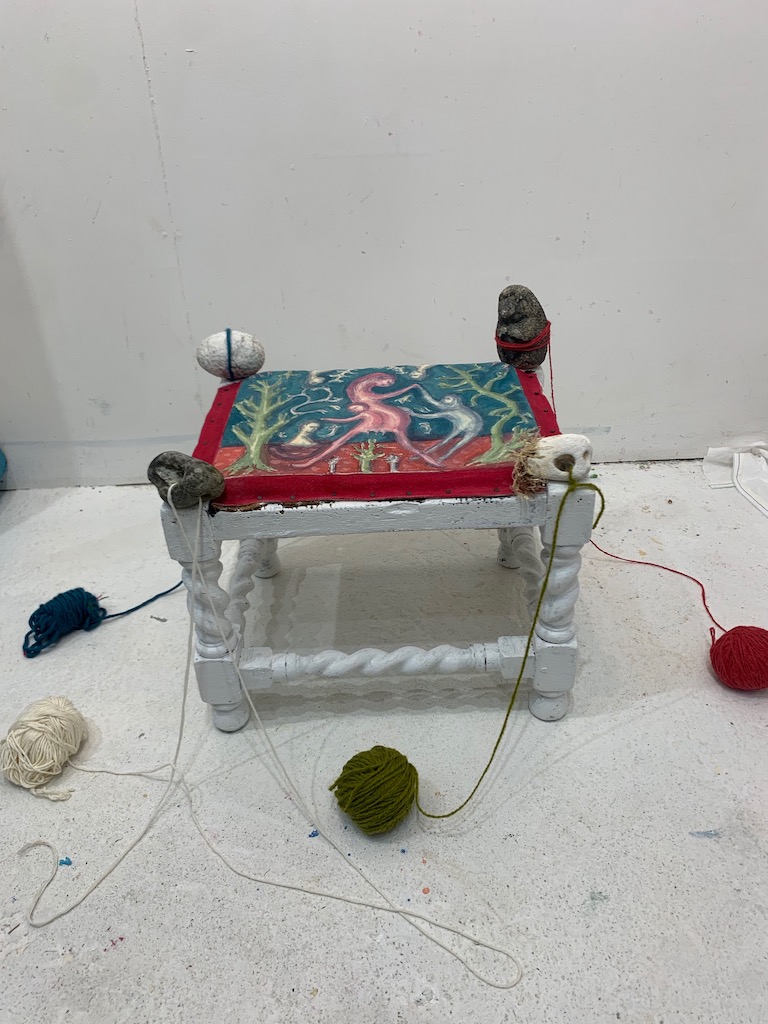 colourful painting and found object installation with wool