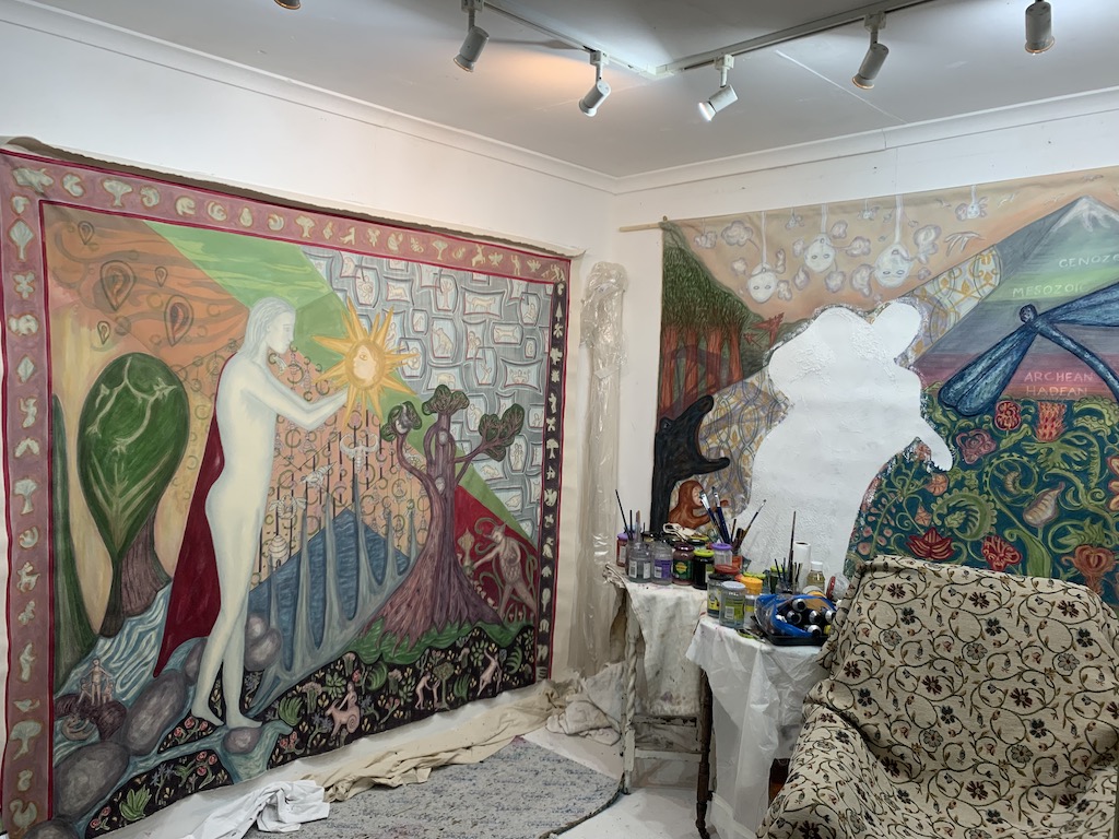 large colourful mythical landscape paintings in Delpha's studio