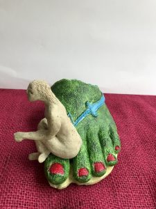 small sculpture with figure and found object