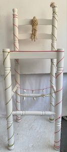 installation sculpture with found chair and chalk hag stones
