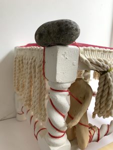 sculpture from found objects with stoneware figure